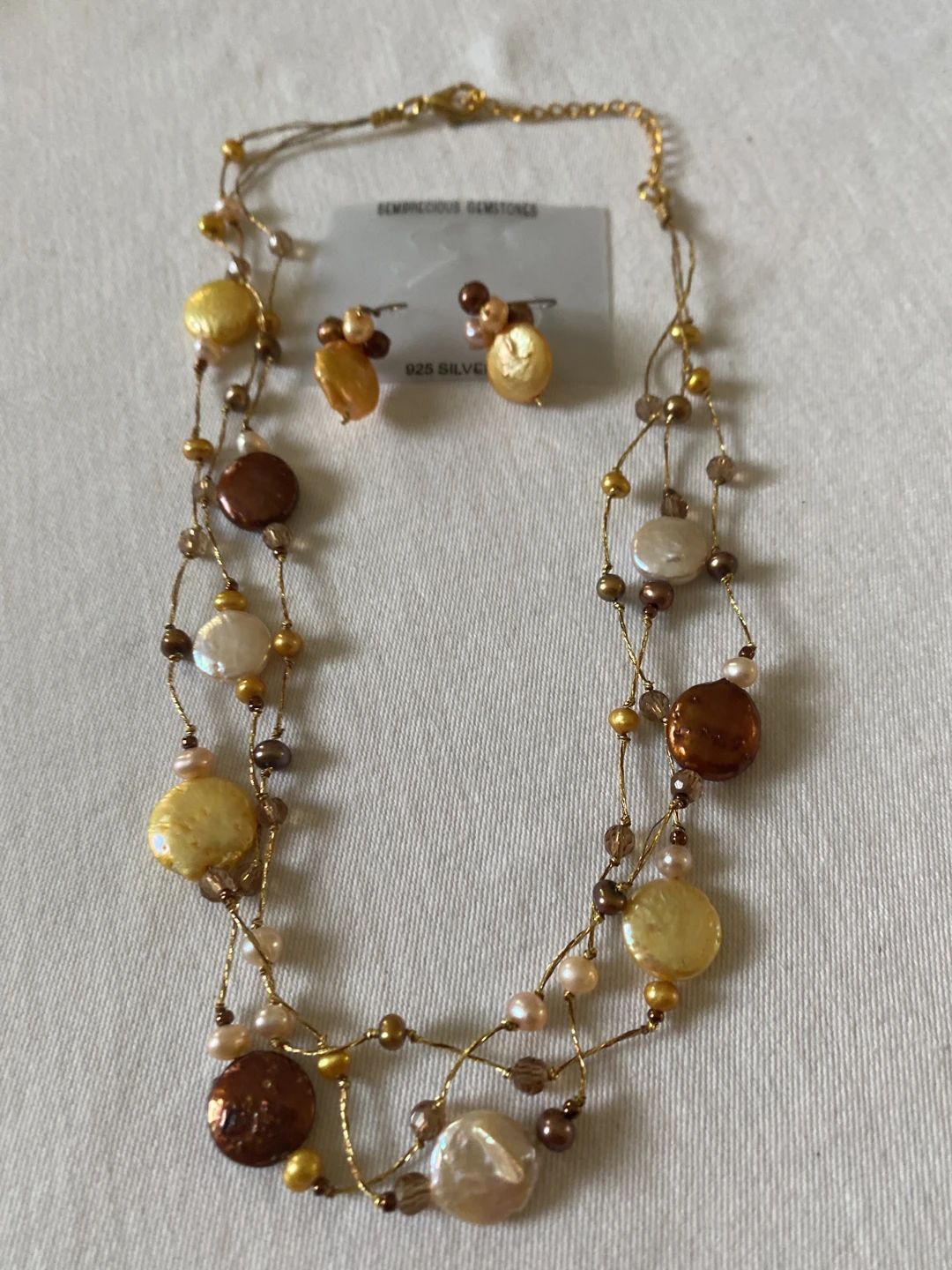 Multi-strand necklace and earring set with iridescent pearls and beads