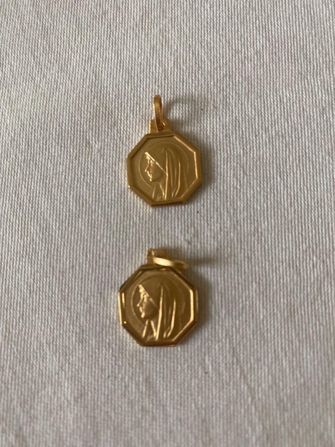 Octagonal Gold Toned Virgin Mary Pendant, likely religious medal