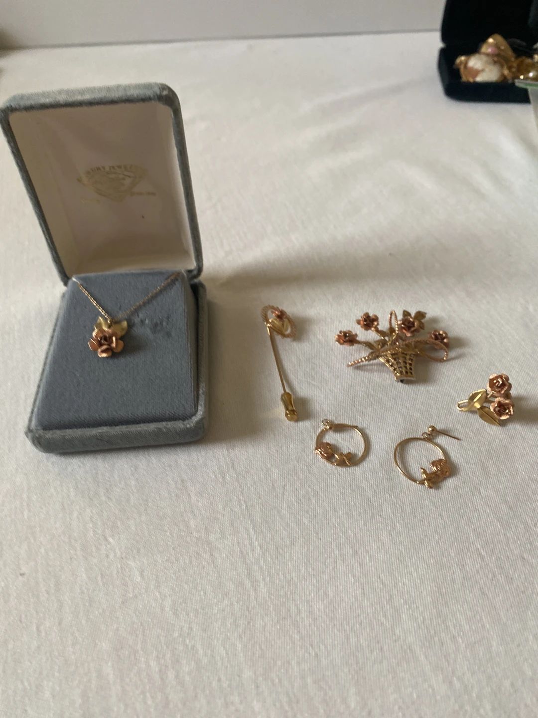 Collection of vintage gold-tone rose motif jewelry pieces